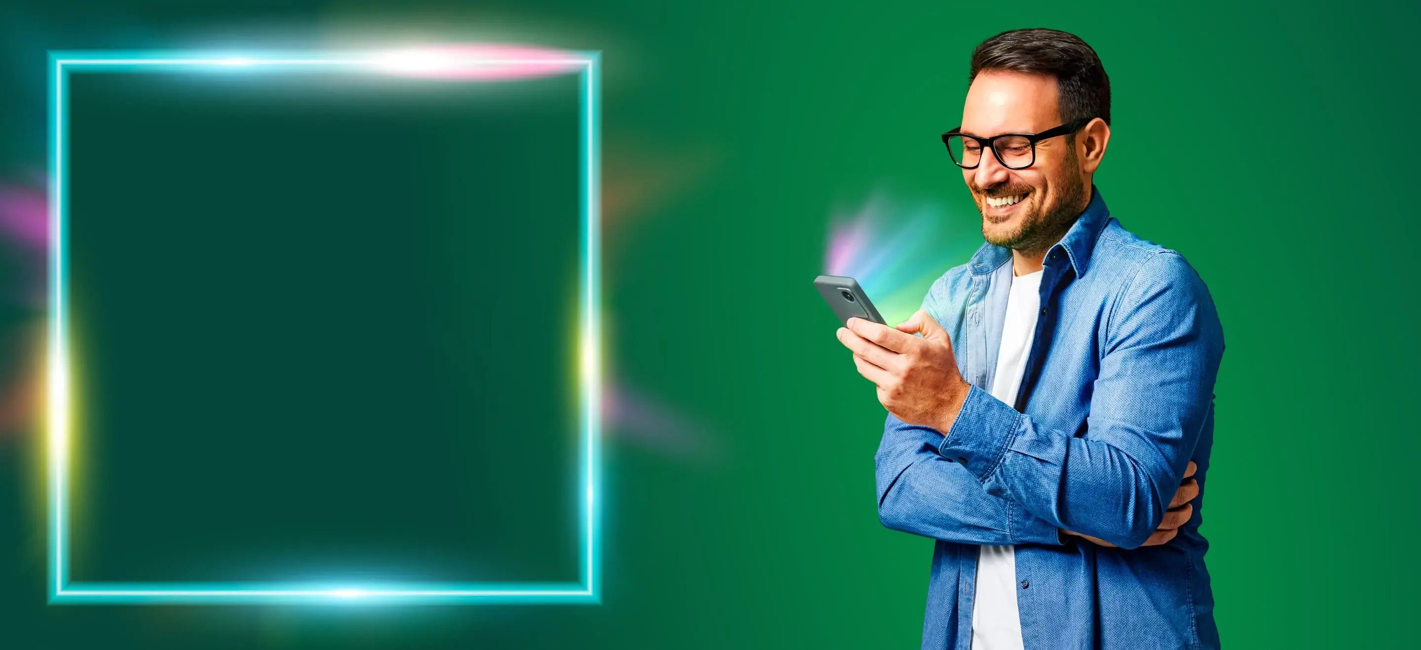 A man smiling at his phone whilst on a Wi-Fi call.